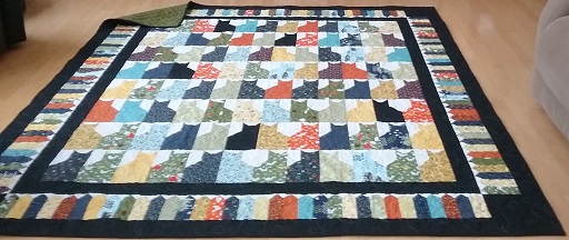 Multicoloured cat quilt