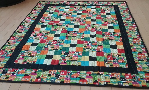 Multicoloured house quilt